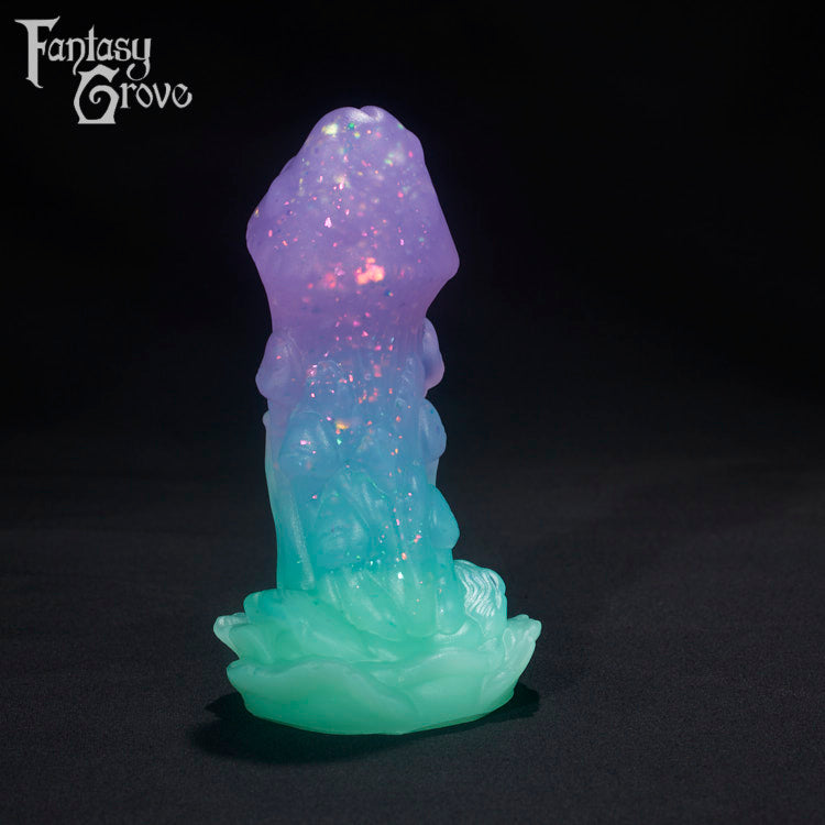 A Fantasy Grove sex toy on a black background with a logo in the upper left corner
