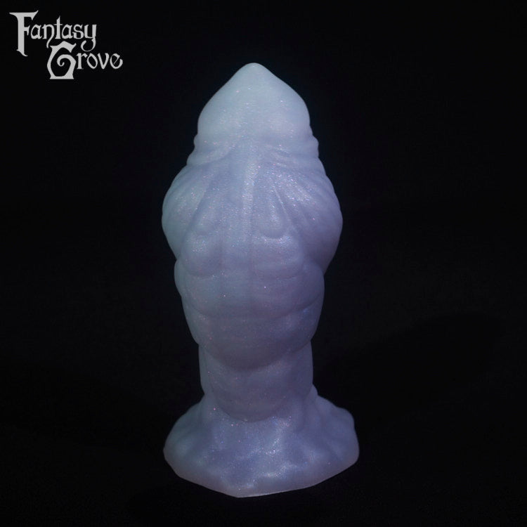 A fantasy sex toy on a black background with the Fantasy Grove logo in the upper left corner