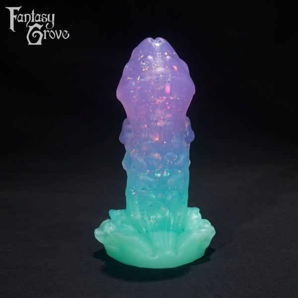 A Fantasy Grove sex toy on a black background with a logo in the upper left corner
