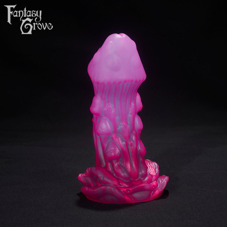 A Fantasy Grove sex toy on a black background with a logo in the upper left corner