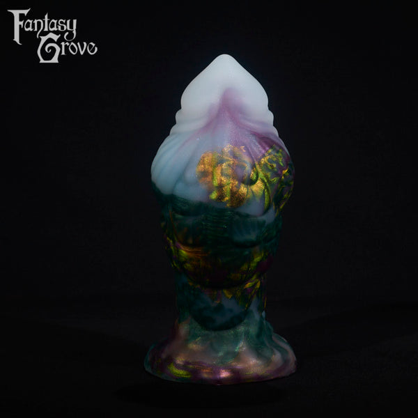 A fantasy sex toy on a black background with the Fantasy Grove logo in the upper left corner