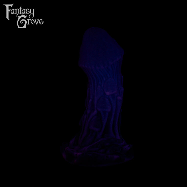 A Fantasy Grove sex toy on a black background with a logo in the upper left corner