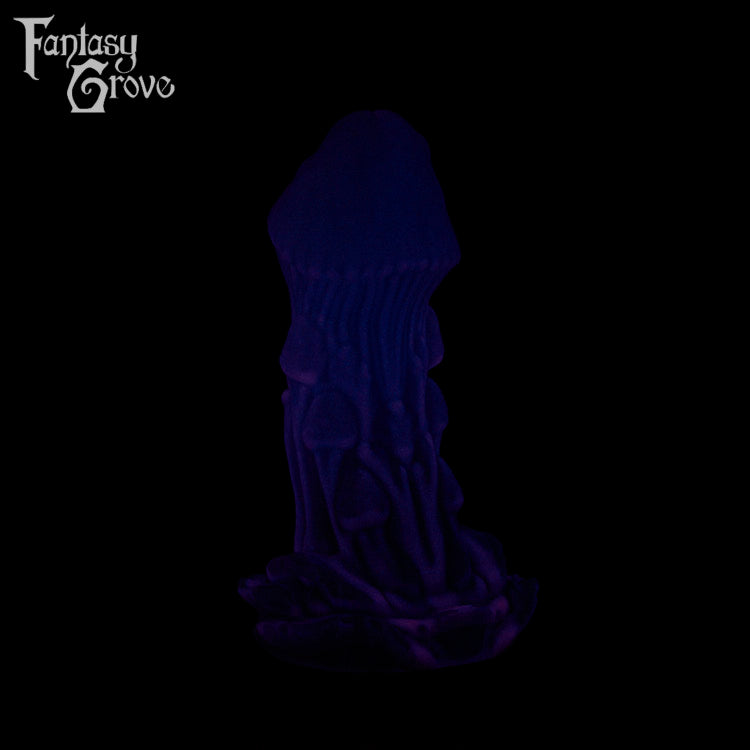 A Fantasy Grove sex toy on a black background with a logo in the upper left corner