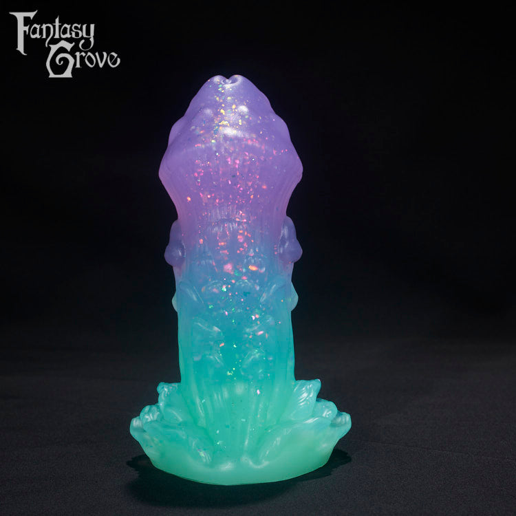 A Fantasy Grove sex toy on a black background with a logo in the upper left corner