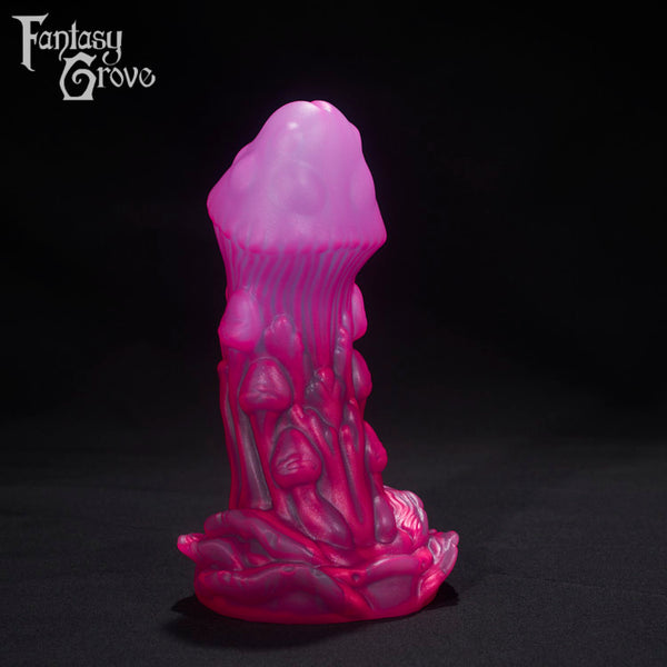 A Fantasy Grove sex toy on a black background with a logo in the upper left corner