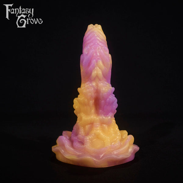 A fantasy sex toy on a black background with the Fantasy Grove logo in the upper left corner
