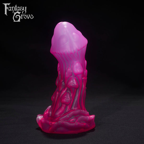A Fantasy Grove sex toy on a black background with a logo in the upper left corner