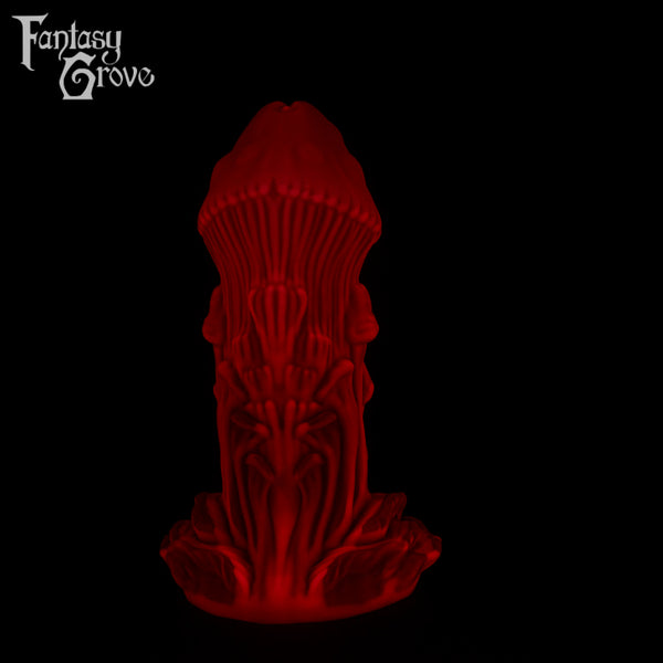 A Fantasy Grove sex toy on a black background with a logo in the upper left corner