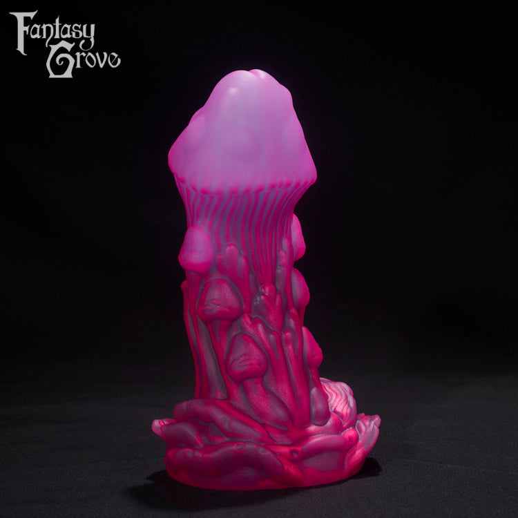 A Fantasy Grove sex toy on a black background with a logo in the upper left corner