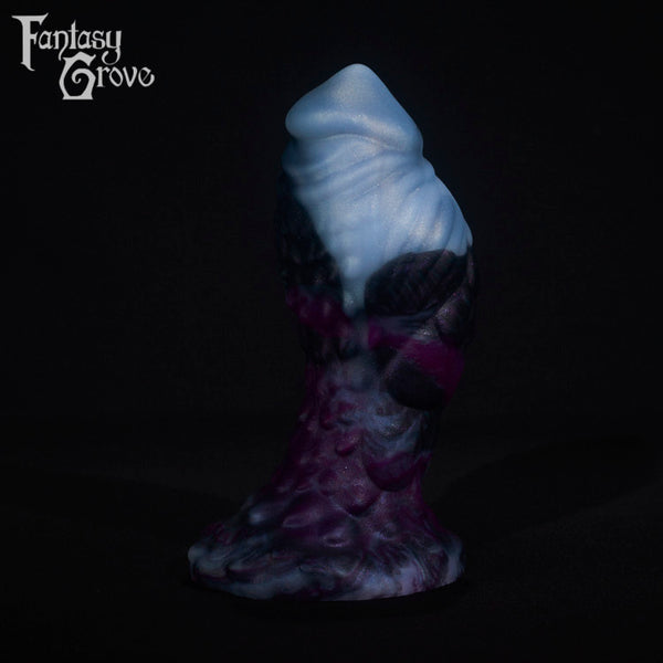 A fantasy sex toy on a black background with the Fantasy Grove logo in the upper left corner