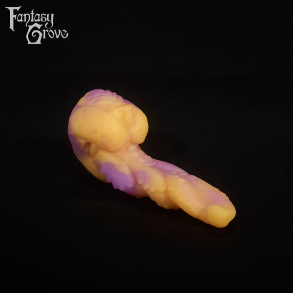 A fantasy sex toy on a black background with the Fantasy Grove logo in the upper left corner