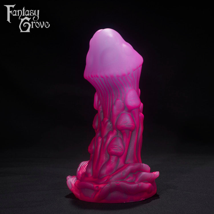 A Fantasy Grove sex toy on a black background with a logo in the upper left corner