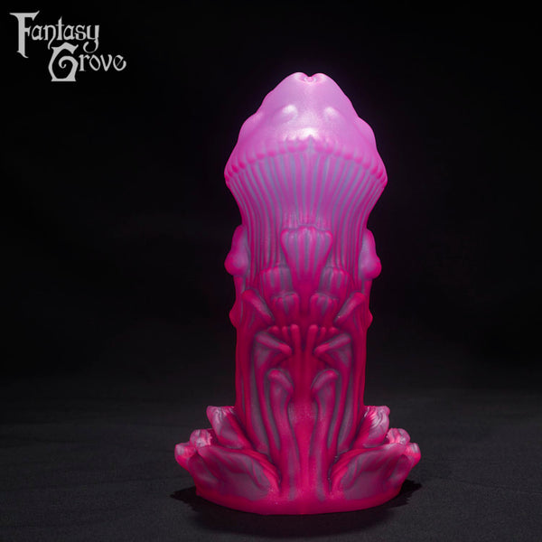 A Fantasy Grove sex toy on a black background with a logo in the upper left corner