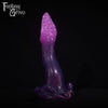 A fantasy sex toy on a black background with the Fantasy Grove logo in the upper left corner