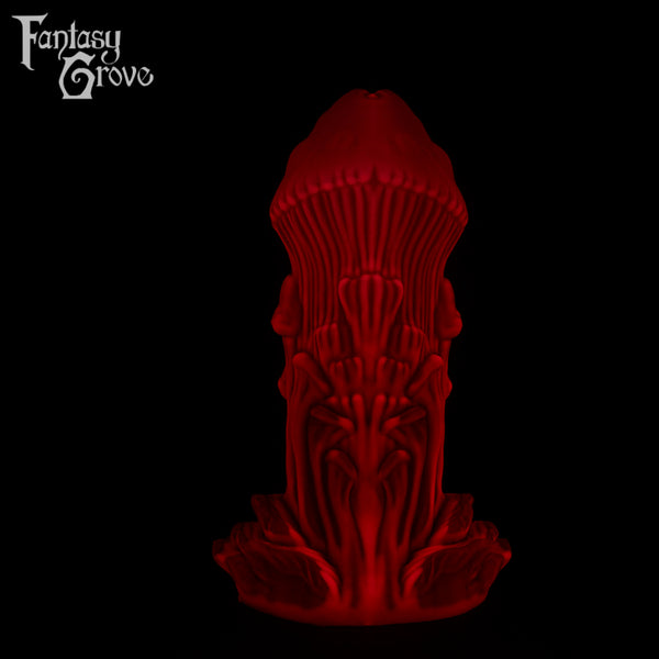 A Fantasy Grove sex toy on a black background with a logo in the upper left corner