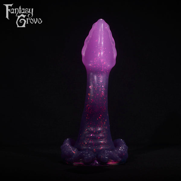 A fantasy sex toy on a black background with the Fantasy Grove logo in the upper left corner