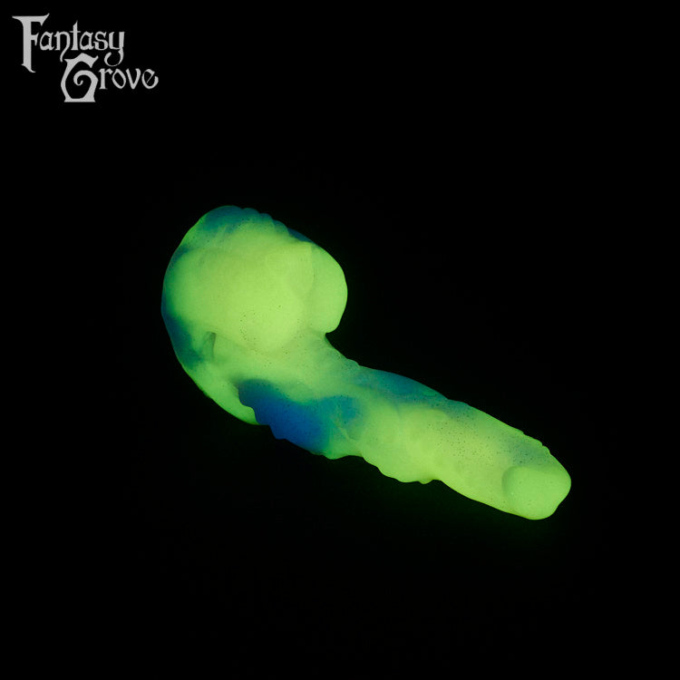 A fantasy sex toy on a black background with the Fantasy Grove logo in the upper left corner