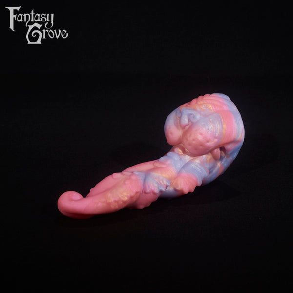 A fantasy sex toy on a black background with the Fantasy Grove logo in the upper left corner