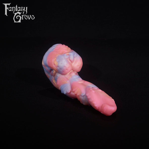 A fantasy sex toy on a black background with the Fantasy Grove logo in the upper left corner