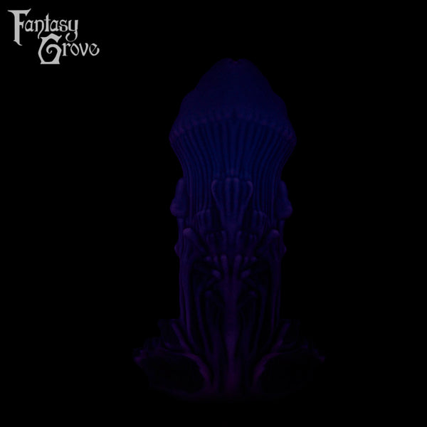A Fantasy Grove sex toy on a black background with a logo in the upper left corner