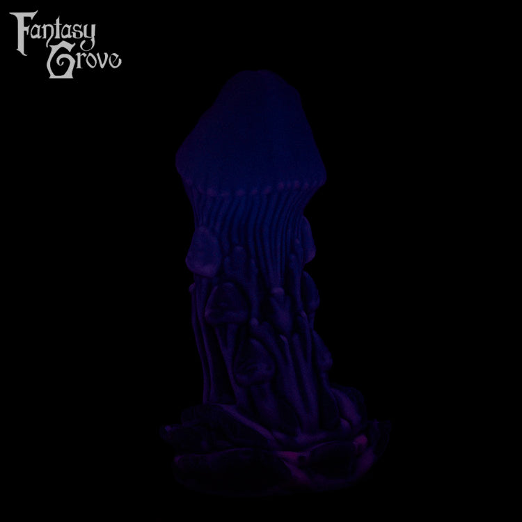 A Fantasy Grove sex toy on a black background with a logo in the upper left corner