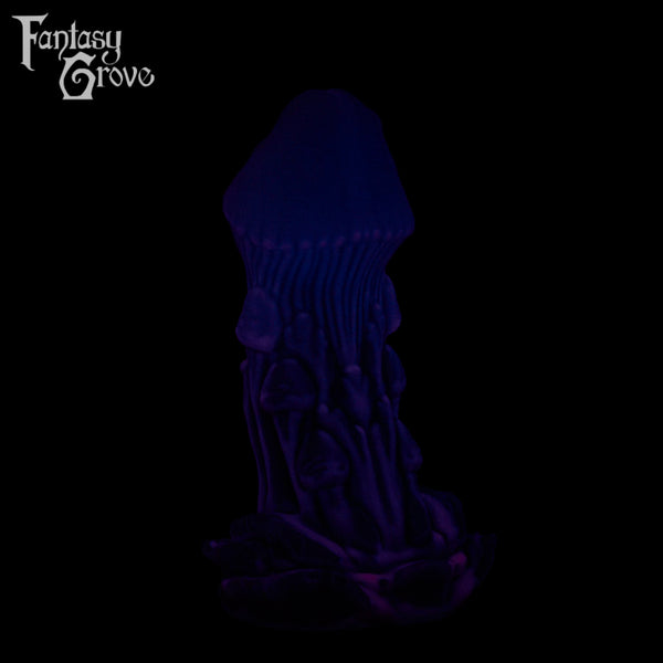 A Fantasy Grove sex toy on a black background with a logo in the upper left corner