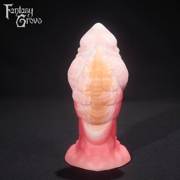 A fantasy sex toy on a black background with the Fantasy Grove logo in the upper left corner 