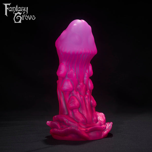 A Fantasy Grove sex toy on a black background with a logo in the upper left corner