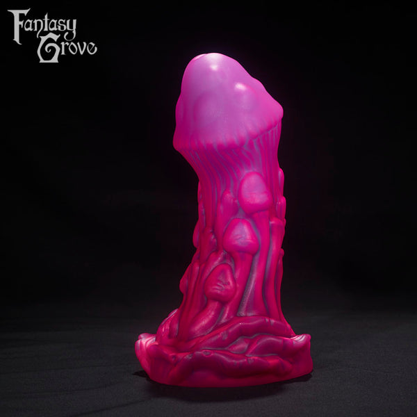 A Fantasy Grove sex toy on a black background with a logo in the upper left corner