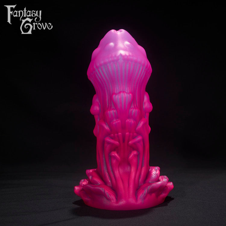 A Fantasy Grove sex toy on a black background with a logo in the upper left corner
