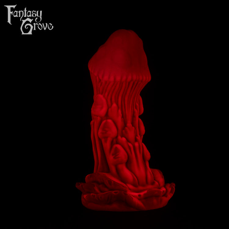 A Fantasy Grove sex toy on a black background with a logo in the upper left corner