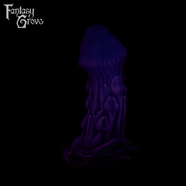A Fantasy Grove sex toy on a black background with a logo in the upper left corner