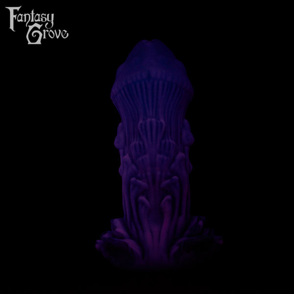 A Fantasy Grove sex toy on a black background with a logo in the upper left corner