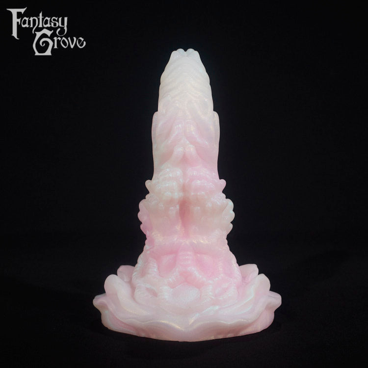 A fantasy sex toy on a black background with the Fantasy Grove logo in the upper left corner