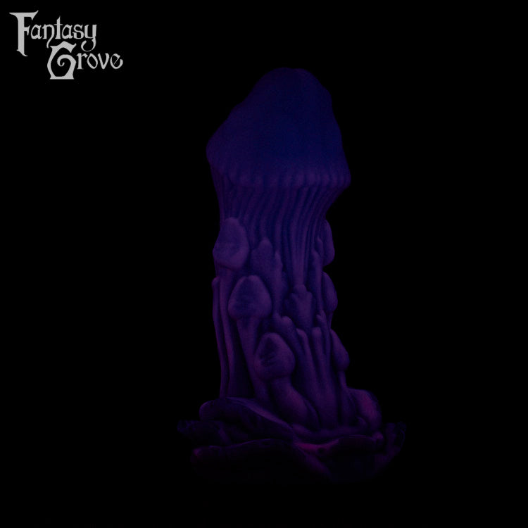 A Fantasy Grove sex toy on a black background with a logo in the upper left corner
