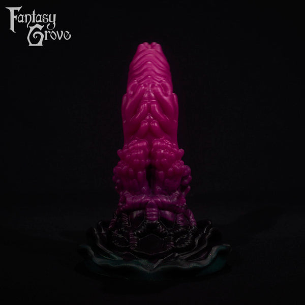 A fantasy sex toy on a black background with the Fantasy Grove logo in the upper left corner