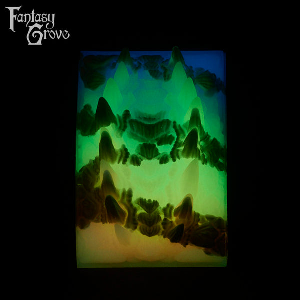 A Fantasy Grove sex toy on a black background with a logo in the upper left corner