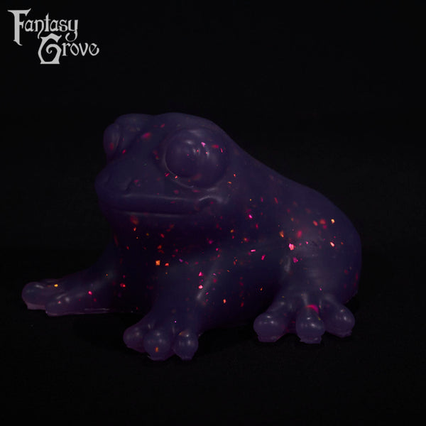 A fantasy sex toy on a black background with the Fantasy Grove logo in the upper left corner