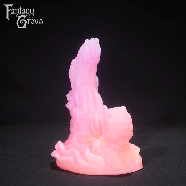 A fantasy sex toy on a black background with the Fantasy Grove logo in the upper left corner 