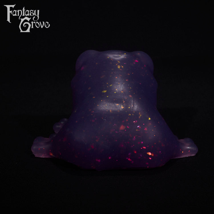 A fantasy sex toy on a black background with the Fantasy Grove logo in the upper left corner