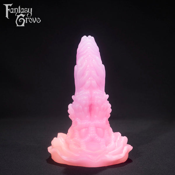 A fantasy sex toy on a black background with the Fantasy Grove logo in the upper left corner 