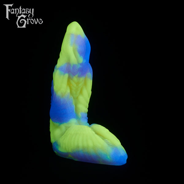 A fantasy sex toy on a black background with the Fantasy Grove logo in the upper left corner