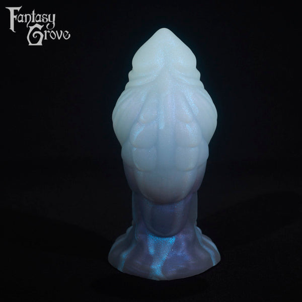 A fantasy sex toy on a black background with the Fantasy Grove logo in the upper left corner