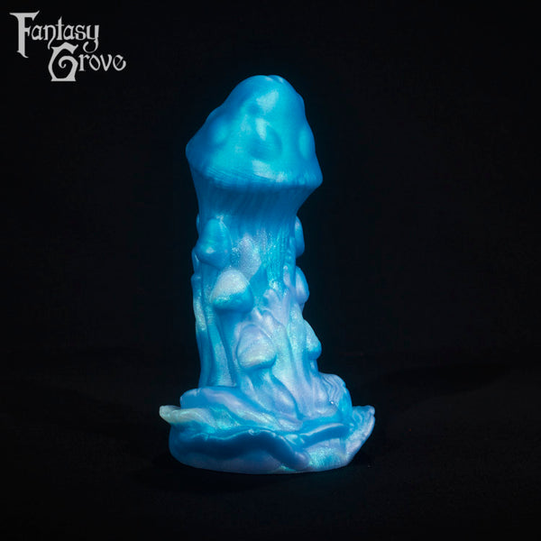 A fantasy sex toy on a black background with the Fantasy Grove logo in the upper left corner