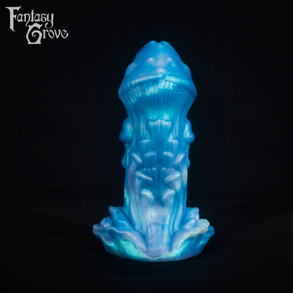 A fantasy sex toy on a black background with the Fantasy Grove logo in the upper left corner