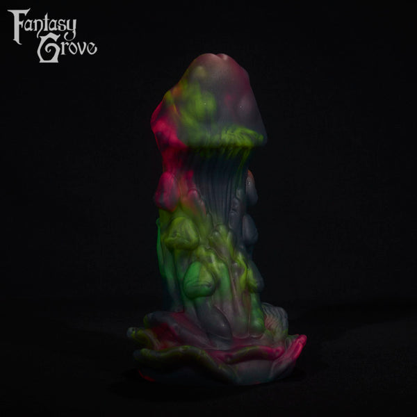 A fantasy sex toy on a black background with the Fantasy Grove logo in the upper left corner