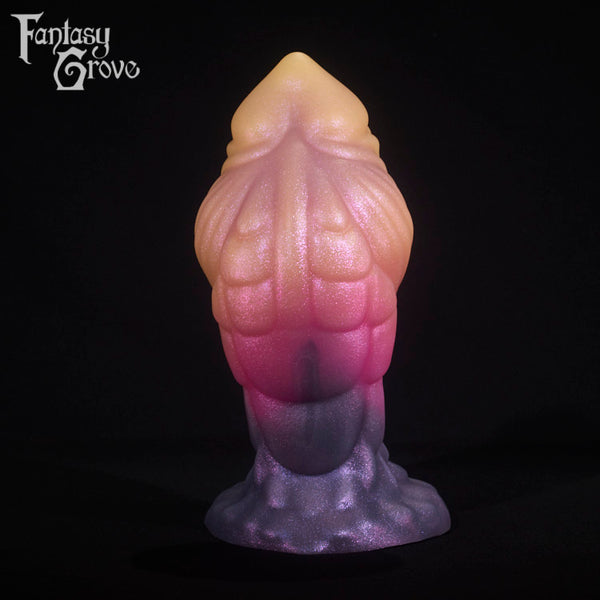 A fantasy sex toy on a black background with the Fantasy Grove logo in the upper left corner