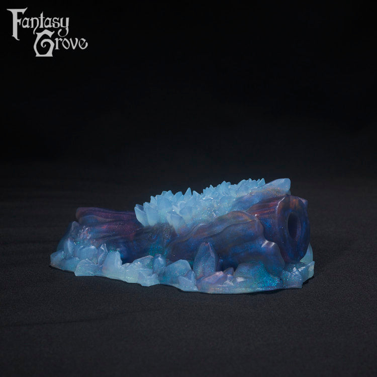 A Fantasy Grove sex toy on a black background with a logo in the upper left corner