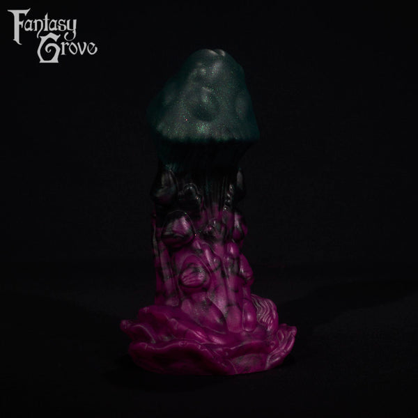 A fantasy sex toy on a black background with the Fantasy Grove logo in the upper left corner