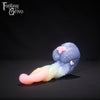 A fantasy sex toy on a black background with the Fantasy Grove logo in the upper left corner 
